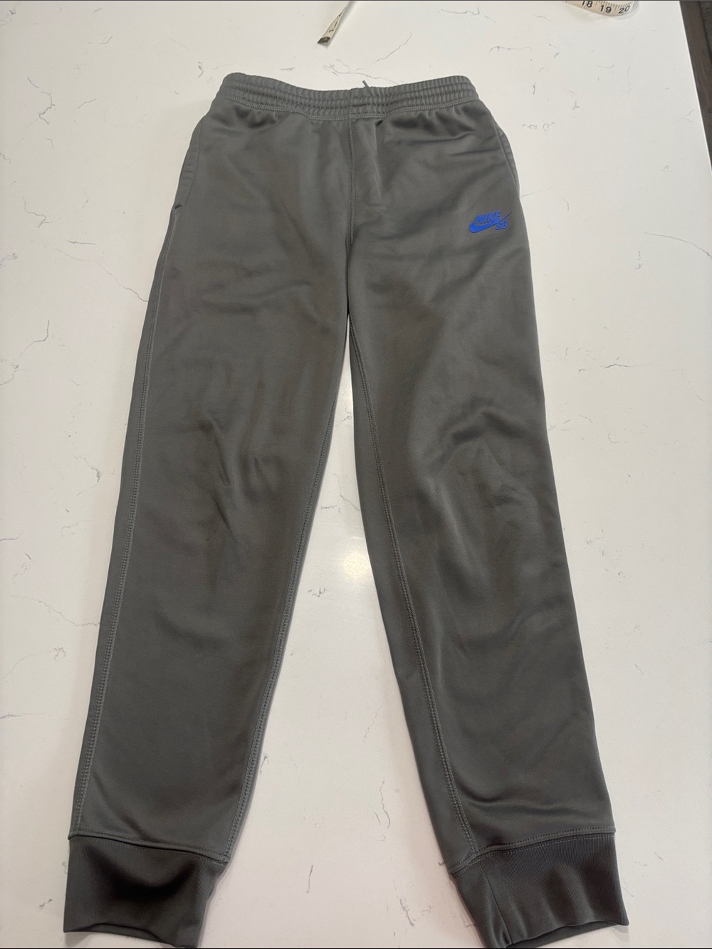 Nike Kids Joggers – Grey with Blue Logo (Size: Large)